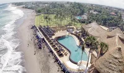 an aerial view of a resort with a swimming pool and the beach at Villa Kobe Beachside Berawa Canggu location in Canggu