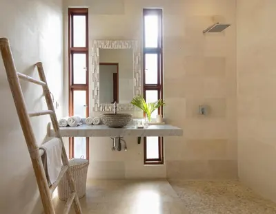 a bathroom with a sink and a mirror at Dream villa Seminyak in Seminyak