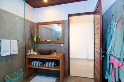 a bathroom with a sink and a mirror at 3BR Villa Erja - Minggu Villas - Special Stay Bonus in Kerobokan