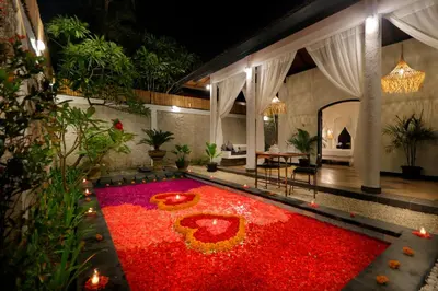 a large room with a large red carpet of flowers at Singgah Villas Seminyak in Seminyak