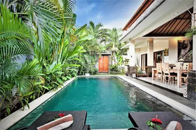 a pool in the backyard of a villa at Rumah Indah Villa in Seminyak