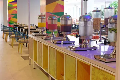 a buffet line with a bunch of food on it at Kuta Beach Club Hotel in Kuta