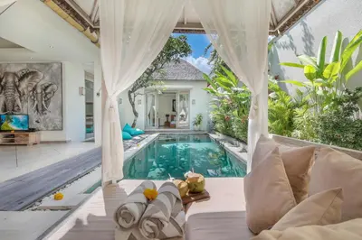 a villa with a pool in the middle of a house at Villa Safari in Seminyak