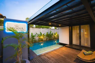 a house with a swimming pool on a deck at Javana Royal Villas in Seminyak