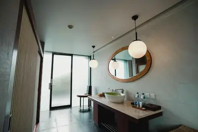 a bathroom with a sink and a mirror at Javana Royal Villas in Seminyak