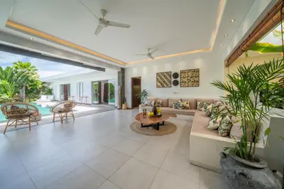 an indoor living room with a couch and a table at Villa Bima - 3 Bedroom Villa in Seminyak in Seminyak