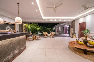an open lobby with a bar and dining area at Villa Bima - 3 Bedroom Villa in Seminyak in Seminyak
