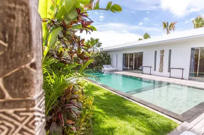 an image of a swimming pool in the backyard of a house at Villa Juna - Beautiful 3 Bedroom in Seminyak in Seminyak