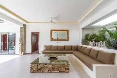 a living room with a couch and a table at Villa Nala - Amazing 3-Bedroom in Seminyak in Seminyak