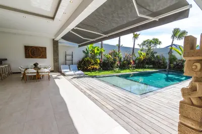 a villa with a swimming pool and a dining area at Villa Nala - Amazing 3-Bedroom in Seminyak in Seminyak