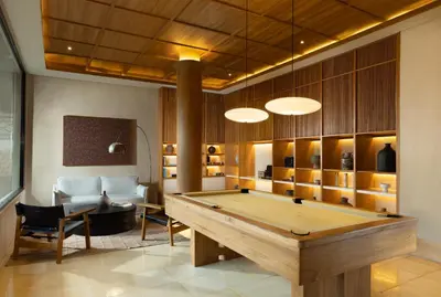 a living room with a pool table in it at Sadara Resort in Nusa Dua