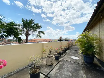 a row of potted plants on a balcony at Nirwana Suites in Denpasar