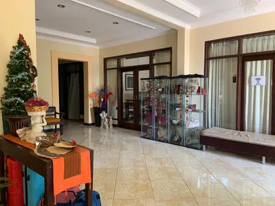 a living room with a christmas tree in a room at Nirwana Suites in Denpasar