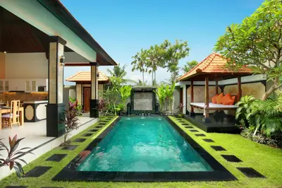 a swimming pool in the backyard of a villa at Concetta Villa Seminyak Beachside By Bali Asia Villa in Seminyak