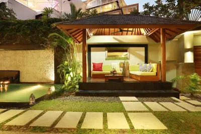a gazebo with a pool in a backyard at Villa The Hotman Paris II Seminyak in Seminyak
