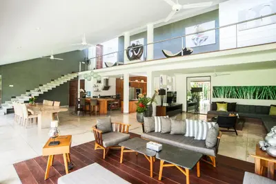 a large living room with a couch and chairs at Kamehameha Luxury Villa in Seminyak