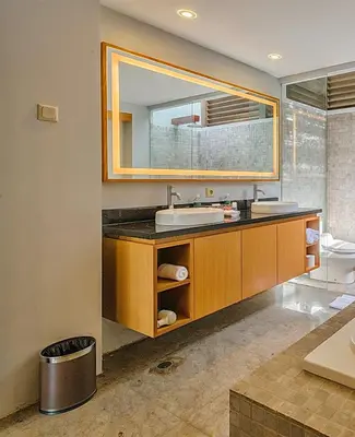 a bathroom with a sink and a mirror at Pradha Villas Seminyak in Seminyak