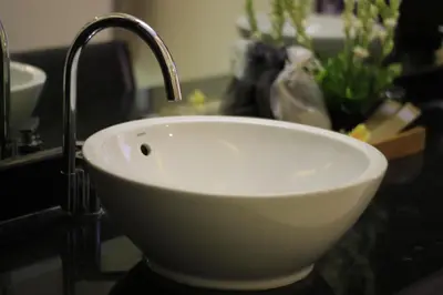 a white sink with a faucet on a counter at The Maya Seminyak Villas in Seminyak