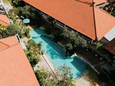 an overhead view of a swimming pool with an orange roof at Baleka Resort & Spa in Legian