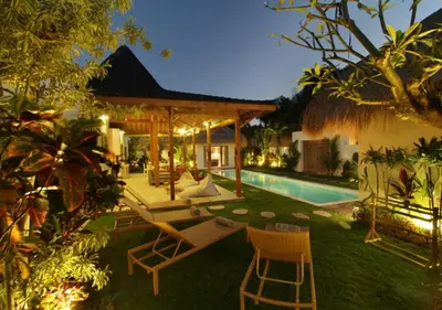 a backyard of a house with a swimming pool at Villa Thiara by Optimum Bali Villas in Seminyak