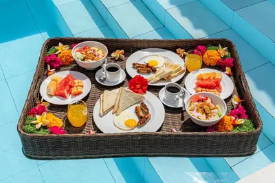 a tray of breakfast foods in a basket at Renovated Villa Gladak, 200m to Oberoi Seminyak in Seminyak