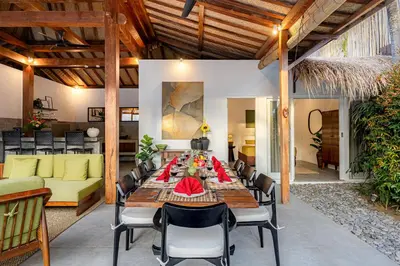 a dining room with a table and chairs at Renovated Villa Gladak, 200m to Oberoi Seminyak in Seminyak