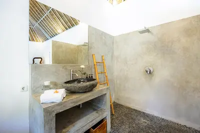 a bathroom with a sink and a mirror at Renovated Villa Gladak, 200m to Oberoi Seminyak in Seminyak