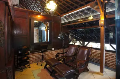 a recording room with a chair and a camera at Putu Bali Villa & Spa in Seminyak