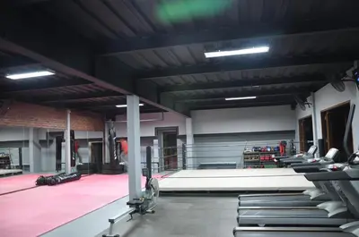 a gym with rows of benches in a room at Putu Bali Villa & Spa in Seminyak