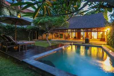 a swimming pool in the backyard of a house at Villa Coco Bali in Seminyak