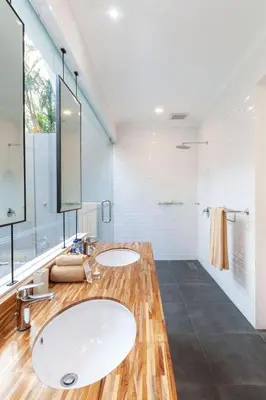 a bathroom with two sinks and a large mirror at Villa Coco Bali in Seminyak