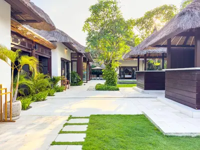 a courtyard of a villa with a resort at Villa Bugis Seminyak in Seminyak