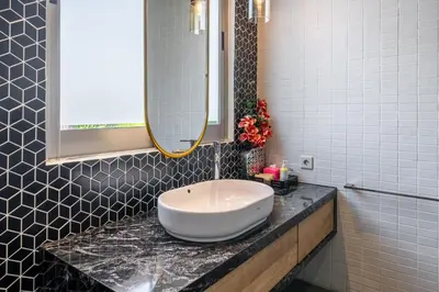 a bathroom with a white sink on a counter at Villa Onyx in Seminyak