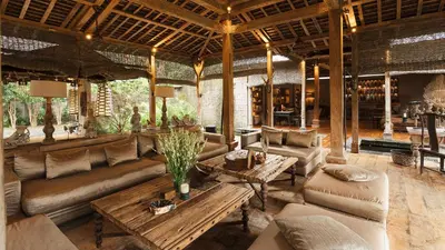 a living room with couches and a table at Villa Zelie in Canggu