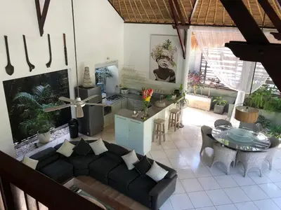 a living room with a couch and a table at Esha Villa Umalas 2 in Kerobokan