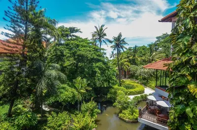 an aerial view of a resort with a river at Bali Garden Beach Resort in Kuta