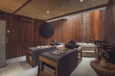 a room with three beds and a bath tub at Sana Vie Villa Seminyak by Ini Vie Hospitality in Seminyak