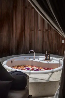a bath tub with a pizza inside of it at Sana Vie Villa Seminyak by Ini Vie Hospitality in Seminyak