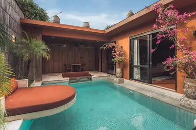 a swimming pool in the backyard of a house at Sana Vie Villa Seminyak by Ini Vie Hospitality in Seminyak
