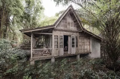 a small house in the middle of a forest at Balquisse Heritage Hotel in Jimbaran