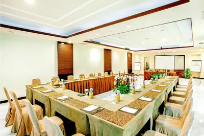 a large banquet hall with long tables and chairs at Rama Beach Resort and Villas in Kuta