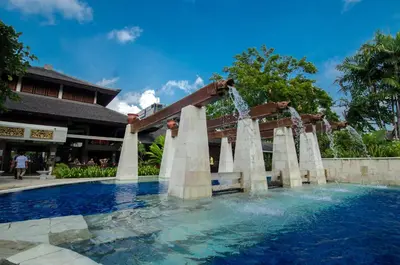 a water slide in a pool at a resort at Rama Beach Resort and Villas in Kuta