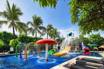 a pool with a water park with a water slide at Hard Rock Hotel Bali in Kuta