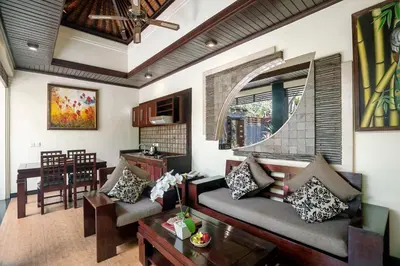 a living room with a couch and a table at The Bali Dream Villa Seminyak in Seminyak