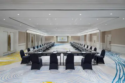 a large conference room with tables and chairs in it at InterContinental Bali Resort by IHG in Jimbaran