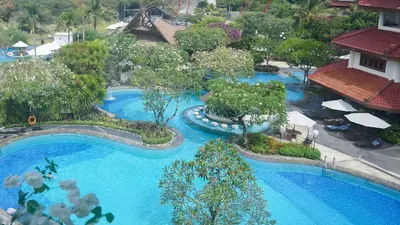 an aerial view of a swimming pool at a resort at Grand Mirage Resort & Thalasso Bali in Nusa Dua