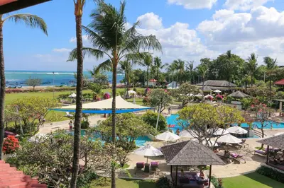 an overview of the resort with the ocean in the background at Holiday Inn Resort Baruna Bali by IHG in Kuta