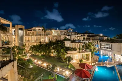 an aerial view of a resort at night at FuramaXclusive Ocean Beach Seminyak Bali in Legian