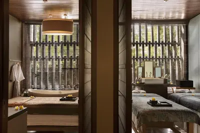a bathroom with a tub and a large window at The Elysian Boutique Villa Hotel in Seminyak