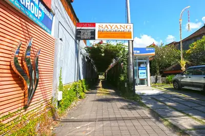 a street with a sign on the side of a building at Sayang Residence 2 in Denpasar